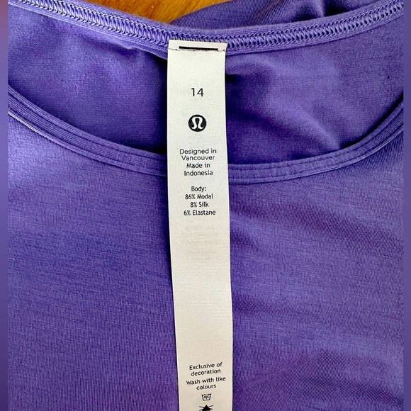 lululemon athletica Tops - This unique, sexy, cold shoulder yoga top could be yours today 💜💜